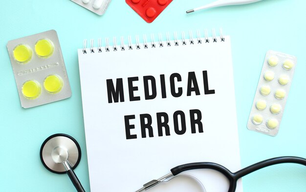 https://www.freepik.com/premium-photo/text-medical-error-is-written-notebook-that-lies-stethoscope-medicine-blue-background_15641441.htm